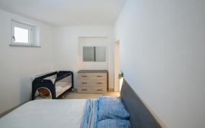 Säng eller sängar i ett rum på Tatta & Nanna Apartment