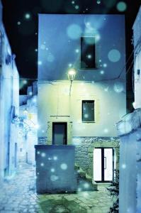 a view of a building with a street at night at L'ArChasetta Historic Apartments in Casamassima