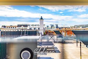 a balcony with a view of a lighthouse on a ship at Eddie’s Design Apartments in Vienna
