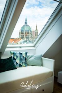 a room with a window with a view of a building at Eddie’s Design Apartments in Vienna +97 photos