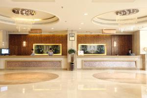 Лобби или стойка регистрации в Qingdao KuaiTong International Hotel