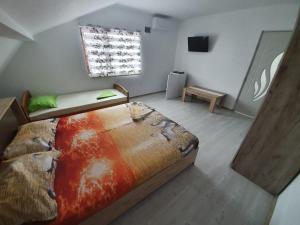 a bedroom with a large bed and a window at Vila Dan in Costinesti +35 photos