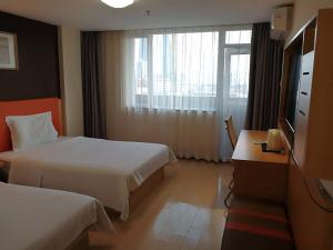 Ένα ή περισσότερα κρεβάτια σε δωμάτιο στο 7Days Premium Xiamen University South Siming Road
