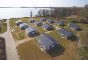 an aerial view of a row of houses next to the water at Witt am See H in Klein Wittensee