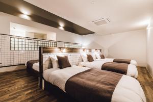 Katil atau katil-katil dalam bilik di Yamahana Onsen Tonden Japanese Inn