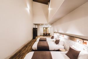 Katil atau katil-katil dalam bilik di Yamahana Onsen Tonden Japanese Inn