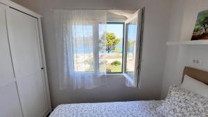Postel nebo postele na pokoji v ubytování Seascape Beach House Korcula