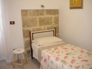 A bed or beds in a room at Villa Nespole e Vermentino