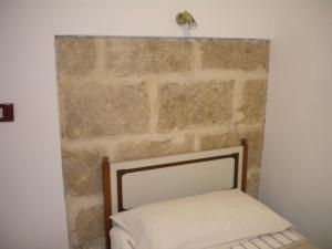 A bed or beds in a room at Villa Nespole e Vermentino