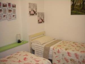 A bed or beds in a room at Villa Nespole e Vermentino