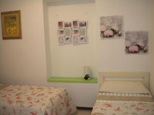 A bed or beds in a room at Villa Nespole e Vermentino