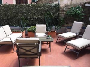 a group of chairs and a table on a patio at M&igrave;aCh&igrave; in Monterosso al Mare