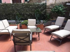 a group of chairs and a table on a patio at MìaChì in Monterosso al Mare