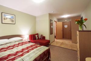 Postel nebo postele na pokoji v ubytování Dzintars Hotel