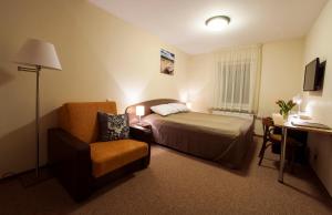 Postel nebo postele na pokoji v ubytování Dzintars Hotel + 37 fotografií