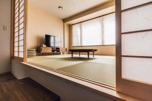 Televisyen dan/atau pusat hiburan di Yamahana Onsen Tonden Japanese Inn