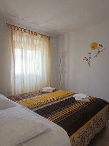 Postel nebo postele na pokoji v ubytování Apartman Mi