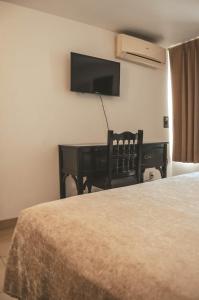 Postel nebo postele na pokoji v ubytování Hotel Latino