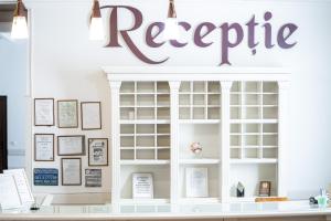 a referric sign above a display case in a store at Hotel Polaris in Suceava