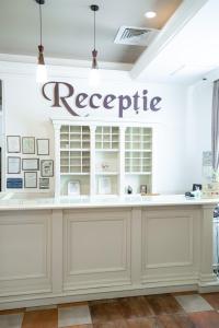 a store front with areciprocal sign on a white wall at Hotel Polaris in Suceava