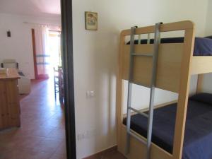 Giường trong phòng chung tại Villetta Sunrise 77