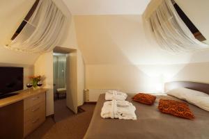 Postel nebo postele na pokoji v ubytování Dzintars Hotel