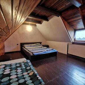 En eller flere senge i et værelse på MARINASURF Baza Wypoczynkowa