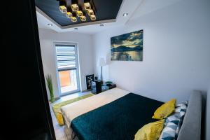 Postel nebo postele na pokoji v ubytování Markiz Apartments