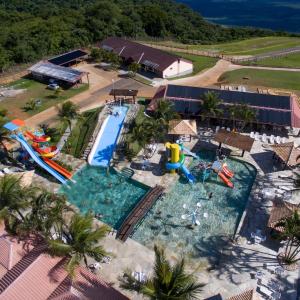 an overhead view of a pool with a water park at Pousada Penhasco in Chapada dos Guimarães