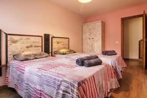 Ένα ή περισσότερα κρεβάτια σε δωμάτιο στο La Casa de Nini