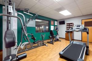 a gym with several treadmills and a treadmill at Wingate by Wyndham Athens GA in Athens