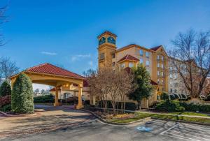 a building with a clock tower on top of it at La Quinta by Wyndham Greensboro NC in Greensboro