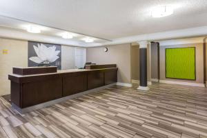 an empty lobby with a green screen in a room at La Quinta Inn by Wyndham Odessa in Odessa +52 photos