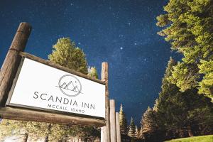 a sign for the santa ana inn near a forest at Scandia Inn in McCall