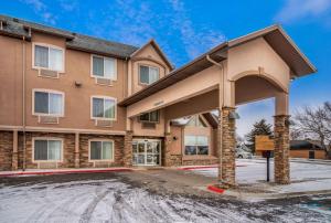 a building with a parking lot in front of it at La Quinta by Wyndham Bozeman in Bozeman