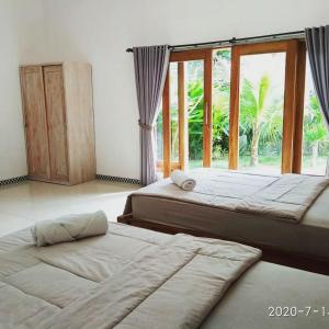 Postel nebo postele na pokoji v ubytování Harris surf villa