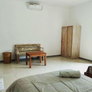 Postel nebo postele na pokoji v ubytování Harris surf villa