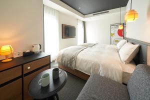 Postel nebo postele na pokoji v ubytování Hotel Resol Ueno + 37 fotografií