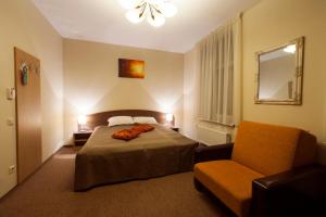 Postel nebo postele na pokoji v ubytování Dzintars Hotel