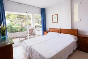 Un ou plusieurs lits dans un hébergement de l'établissement Mallorca Rooms Peguera