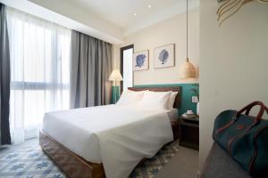 Giường trong phòng chung tại Coralina Hotel & Free Spa Voucher