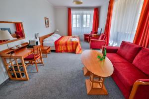 Łóżko lub łóżka w pokoju w obiekcie LH Hotel Dvořák Tábor Congress & Wellness