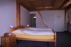 Postel nebo postele na pokoji v ubytování juhui Lenzerheide