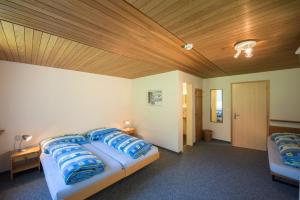 Postel nebo postele na pokoji v ubytování juhui Lenzerheide