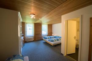 Postel nebo postele na pokoji v ubytování juhui Lenzerheide
