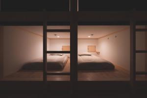 Ένα ή περισσότερα κρεβάτια σε δωμάτιο στο THY GUEST HOUSE