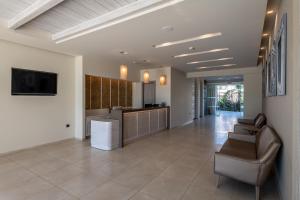 a large room with a kitchen and a living room at ONEIRO Boutique Hotel in Tigaki