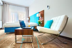Posteľ alebo postele v izbe v ubytovaní Apartamenty AmberHome