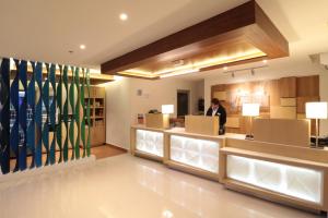 a man standing in the lobby of a store at Holiday Inn Express Piedras Negras, an IHG Hotel in Piedras Negras