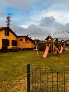 a yard with a playground with a slide at Hotel Maruja Nozana in Viella